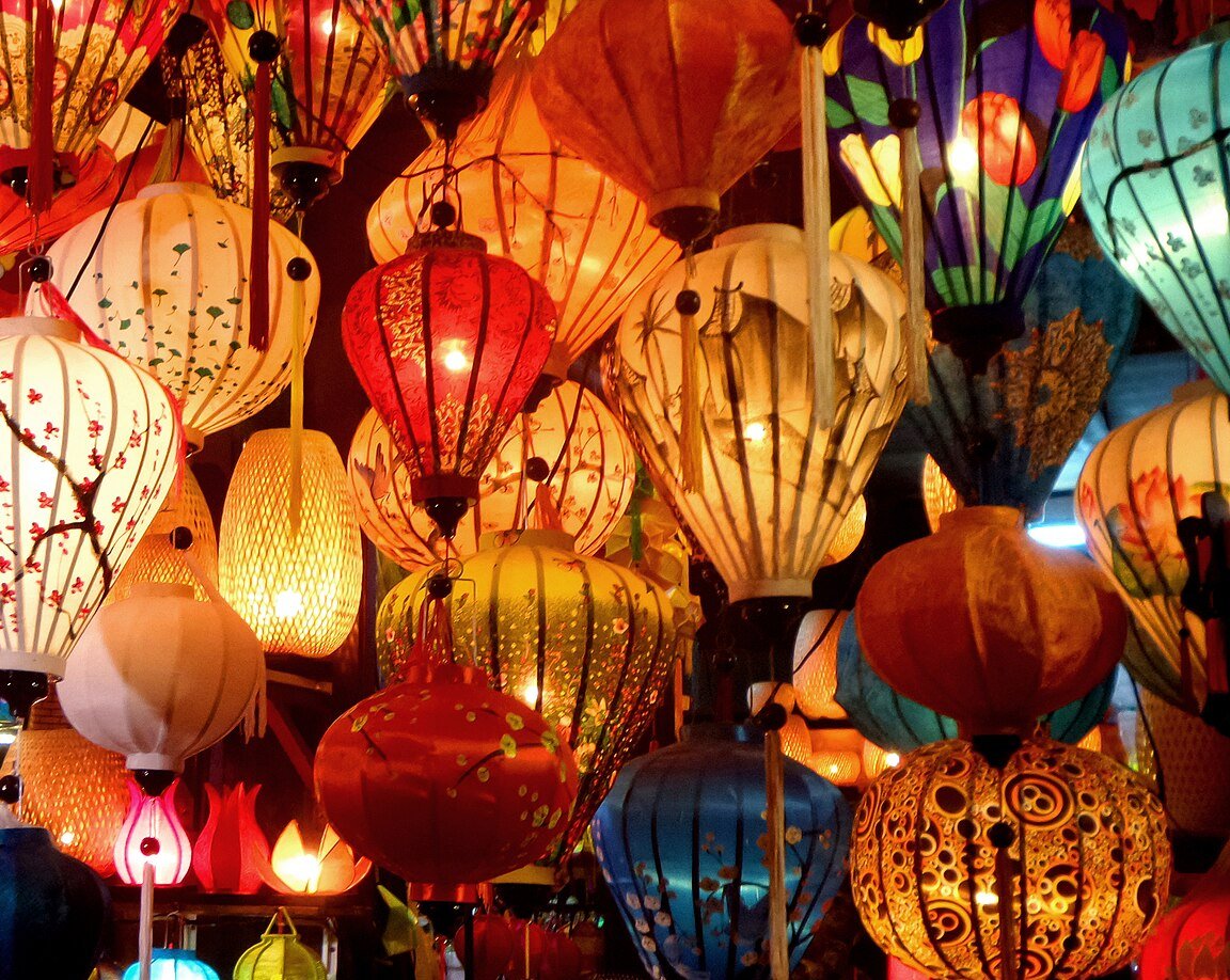 Colorful silk lanterns lit up at a shop in Hoi An, a popular evening spot when dating in Vietnam as a foreigner