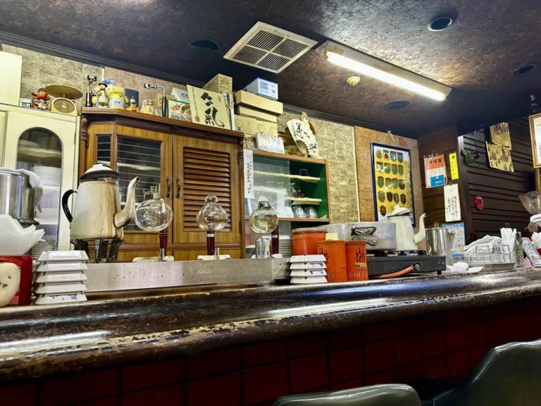 Counter of a traditional Japanese kissaten coffee shop, a relaxed spot to try cross-cultural first date questions