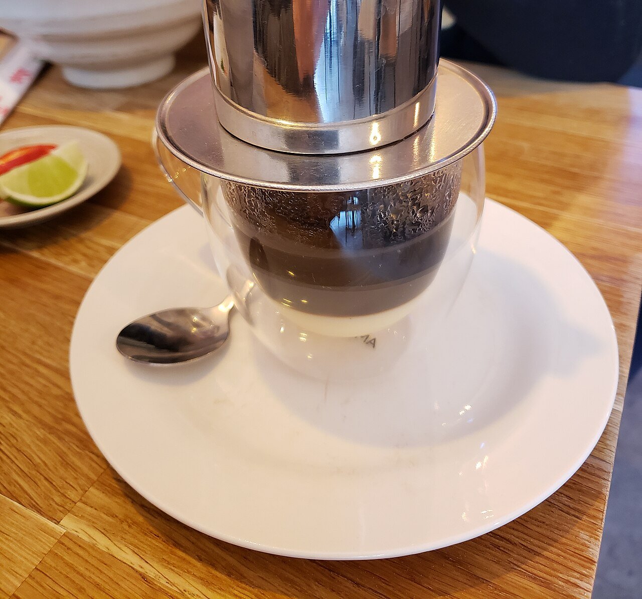 Vietnamese phin drip coffee on a café table, a relaxed first meeting idea for dating in Vietnam as a foreigner